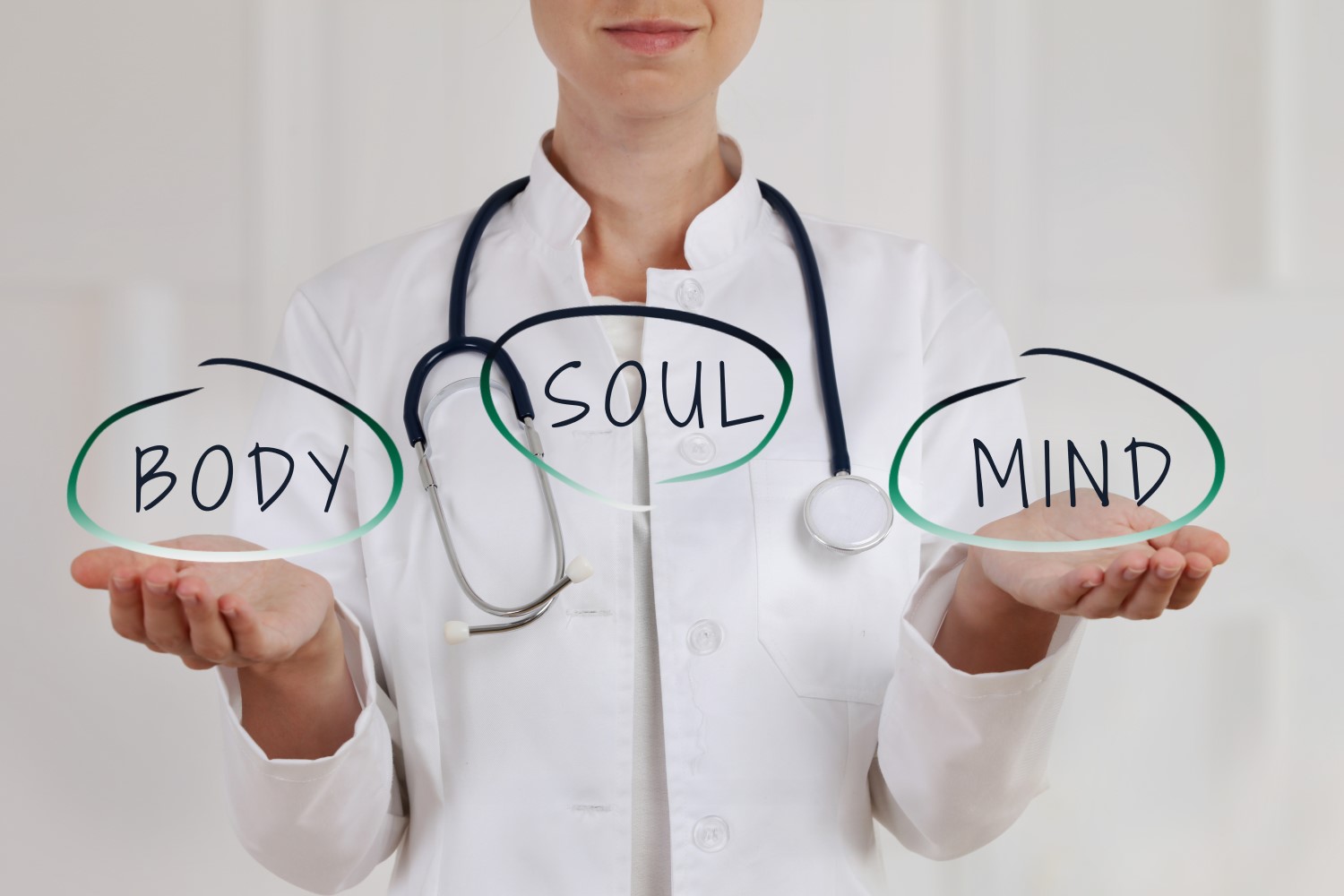  A doctor holds her hands out with the words 'body', 'soul', and 'mind' floating above them to represent a holistic approach to heart disease treatment.